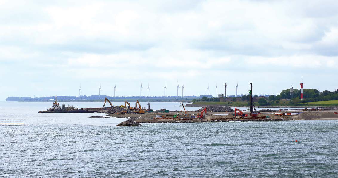 Cranes and excavators at a new port facility for the Fehmarnbelt Tunnel Link project that will link Denmark and Germany.