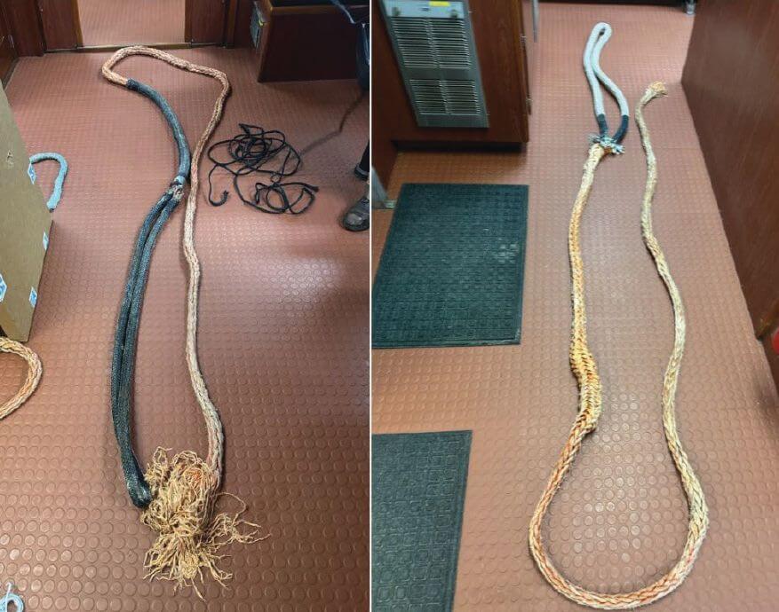 Two recovered synthetic push line pennants laid out on a deck floor, one with a frayed, parted end.